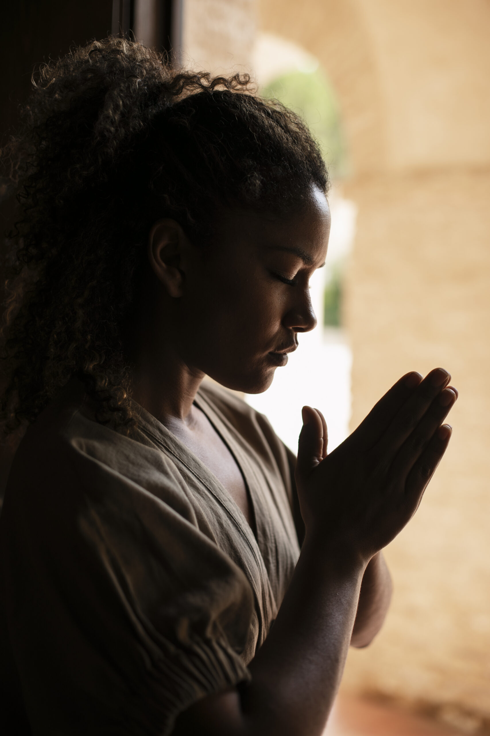 medium-shot-young-woman-praying